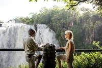 Picture of a couple staring at Victoria Falls on safari in Africa